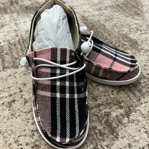 Corky’s pink plaid kayak shoes